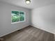 Bright bedroom featuring a large window and neutral carpet, offering a blank canvas for personalization at 916 Waring St, Durham, NC 27704