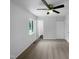 Bright bedroom offers natural light, neutral carpet, and a ceiling fan for added comfort at 916 Waring St, Durham, NC 27704