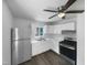 Well-lit kitchen with modern appliances, white cabinets, and ample counter space at 916 Waring St, Durham, NC 27704