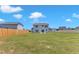 Large backyard with a view of the rear of the house featuring a concrete patio at 960 Sandyhill Rd, Wendell, NC 27591