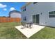 The backyard has a concrete patio and a table with chairs great for outdoor dining at 960 Sandyhill Rd, Wendell, NC 27591
