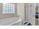 Bathroom features a tub and separate shower at 960 Sandyhill Rd, Wendell, NC 27591