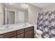 Bathroom features a double vanity and shower at 960 Sandyhill Rd, Wendell, NC 27591