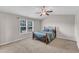 Spacious bedroom features a fan, window and neutral walls at 960 Sandyhill Rd, Wendell, NC 27591