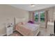 Cozy bedroom features natural light and curtains at 960 Sandyhill Rd, Wendell, NC 27591