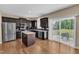 Updated kitchen boasts stainless appliances, an island, and access to the outdoor patio at 960 Sandyhill Rd, Wendell, NC 27591
