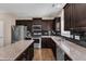 Well-appointed kitchen featuring granite counters, stainless appliances, and dark cabinetry at 960 Sandyhill Rd, Wendell, NC 27591