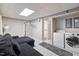 Basement laundry area with washer and dryer next to a comfortable sitting area at 9801 Honeycutt Rd, Raleigh, NC 27614