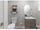 Bathroom with floating shelves and modern finishes at 9801 Honeycutt Rd, Raleigh, NC 27614