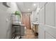 Well-lit bathroom features a vanity with intricate detailing and a shower with curtain at 9801 Honeycutt Rd, Raleigh, NC 27614