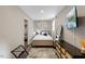 Compact bedroom featuring modern furnishings, a comfortable bed, and stylish decor at 9801 Honeycutt Rd, Raleigh, NC 27614