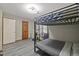 Bedroom features a bunk bed, unique curtains, and laminate floors at 9801 Honeycutt Rd, Raleigh, NC 27614