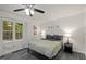 Cozy bedroom with lots of natural light and modern ceiling fan at 9801 Honeycutt Rd, Raleigh, NC 27614