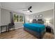 This bedroom features modern decor, neutral paint colors and a ceiling fan at 9801 Honeycutt Rd, Raleigh, NC 27614