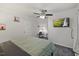 Bedroom featuring ceiling fan, closet, and mounted flat screen television at 9801 Honeycutt Rd, Raleigh, NC 27614