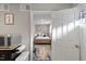 View of a compact bedroom with connecting doors from an adjacent kitchenette at 9801 Honeycutt Rd, Raleigh, NC 27614