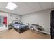 Bedroom with a comfortable bed, table and chairs, and bright overhead lighting at 9801 Honeycutt Rd, Raleigh, NC 27614