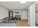Neutral bedroom featuring a TV, furnishings, and a closet door at 9801 Honeycutt Rd, Raleigh, NC 27614