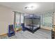 Bedroom features a bunk bed, unique curtains, and furniture at 9801 Honeycutt Rd, Raleigh, NC 27614