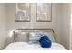 Well-lit bedroom with stylish decor and comfortable bedding, creating a cozy and inviting space at 9801 Honeycutt Rd, Raleigh, NC 27614