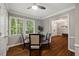 Bright dining area with a dark wood floors, and large window offering ample natural light at 9801 Honeycutt Rd, Raleigh, NC 27614