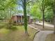 Stunning brick home with an attached three car garage and a front yard with mature landscaping at 9801 Honeycutt Rd, Raleigh, NC 27614