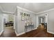 Inviting foyer with wood floors, stylish decor, and access to multiple rooms at 9801 Honeycutt Rd, Raleigh, NC 27614