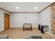 Spacious game room with a foosball table for entertainment and fun at 9801 Honeycutt Rd, Raleigh, NC 27614