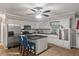 Beautiful kitchen with stainless appliances, white cabinets, breakfast bar and wood-look floors at 9801 Honeycutt Rd, Raleigh, NC 27614