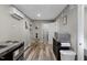 Cozy kitchenette with stainless steel appliances and a glass-top dining table at 9801 Honeycutt Rd, Raleigh, NC 27614