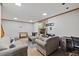 Cozy living room with stone fireplace, TV, foosball table, and desk space, perfect for relaxation and entertainment at 9801 Honeycutt Rd, Raleigh, NC 27614