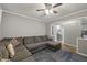 Spacious living room features plush sectional seating and a view of an adjacent room at 9801 Honeycutt Rd, Raleigh, NC 27614