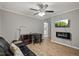 Modern living room with vinyl flooring, fireplace and work space at 9801 Honeycutt Rd, Raleigh, NC 27614