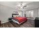 Comfortable main bedroom featuring a ceiling fan, and dark wood-look floors at 9801 Honeycutt Rd, Raleigh, NC 27614