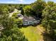 Wide aerial view of the property, showcasing the home's layout, landscaping, and lush greenery in a serene neighborhood at 1000 College St, Oxford, NC 27565