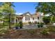 This backyard has a patio with an outdoor seating area, and a screened in porch attached to the home at 1000 College St, Oxford, NC 27565