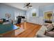 Large bonus room featuring a neutral couch, fireplace, and blue walls at 1000 College St, Oxford, NC 27565