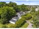Aerial perspective of detached garage with living space above it, complementing the property's features and backyard at 1000 College St, Oxford, NC 27565