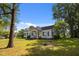 Traditional two-story home with black shutters on windows, a front porch, and a well-manicured lawn at 1000 College St, Oxford, NC 27565