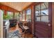 This laundry room has wood paneled walls and contains an exterior door with access to the backyard at 1000 College St, Oxford, NC 27565