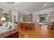 Spacious living room with hardwood floors and built-in bookshelves, perfect for entertaining guests at 1000 College St, Oxford, NC 27565