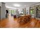 Bright living room features hardwood floors, large windows, and a view of the beautiful surroundings at 1000 College St, Oxford, NC 27565