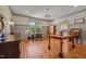 Spacious office with hardwood floors, detailed wainscoting, and a large window overlooking the yard at 1000 College St, Oxford, NC 27565