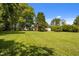 The property is a large lot with a spacious lawn, trees, shrubs and the home sits far off the road at 1000 College St, Oxford, NC 27565
