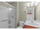 Bathroom featuring a glass shower, vanity, and integrated toilet, with interior views and nice lighting fixtures at 101 Quarryrock Rd, Holly Springs, NC 27540