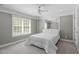 Serene bedroom with a cozy bed, light gray walls, and a window with outdoor views, creating a tranquil retreat at 101 Quarryrock Rd, Holly Springs, NC 27540