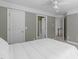 Spacious bedroom featuring neutral walls, a ceiling fan, carpet flooring, and an open doorway leading to other areas at 101 Quarryrock Rd, Holly Springs, NC 27540