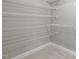 A well-organized walk-in closet with multiple levels of wire shelving for optimal storage and organization at 101 Quarryrock Rd, Holly Springs, NC 27540