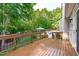 A wood deck overlooking a well-maintained yard with a gazebo and swimming pool at 101 Quarryrock Rd, Holly Springs, NC 27540