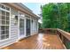 Spacious outdoor deck area, perfect for entertaining, leading from the house to the landscaped yard at 101 Quarryrock Rd, Holly Springs, NC 27540